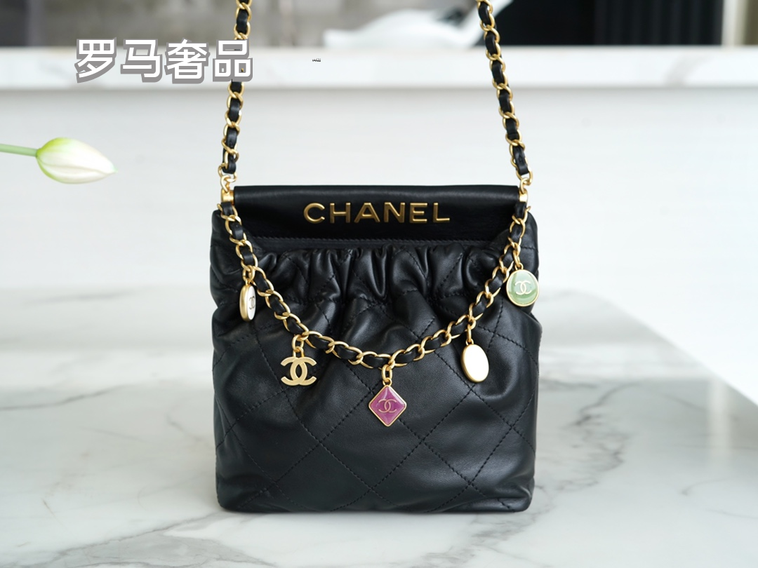 Pink Quilted Leather Bucket Bag with Gold-Tone Chain and Decorative Charms