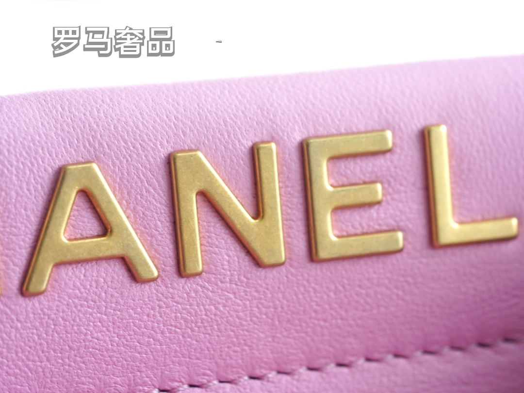 Pink Quilted Leather Bucket Bag with Gold-Tone Chain and Decorative Charms