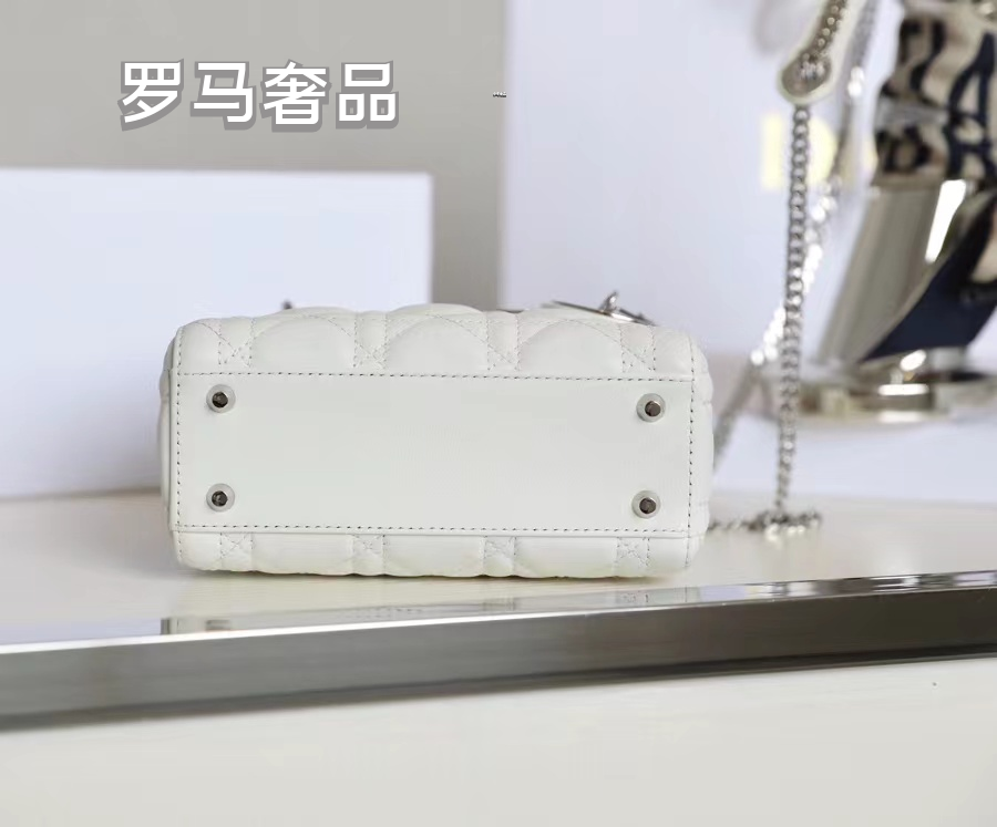 Elegant White Quilted Mini Handbag with Top Handle and Gold-Tone Charms