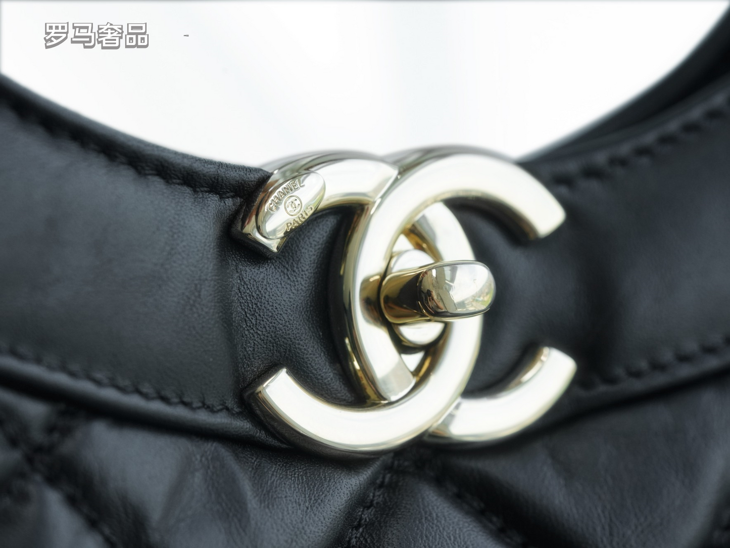 Luxury Black Quilted Leather Handbag with Gold-Tone Chain Strap and Cut-Out Handles