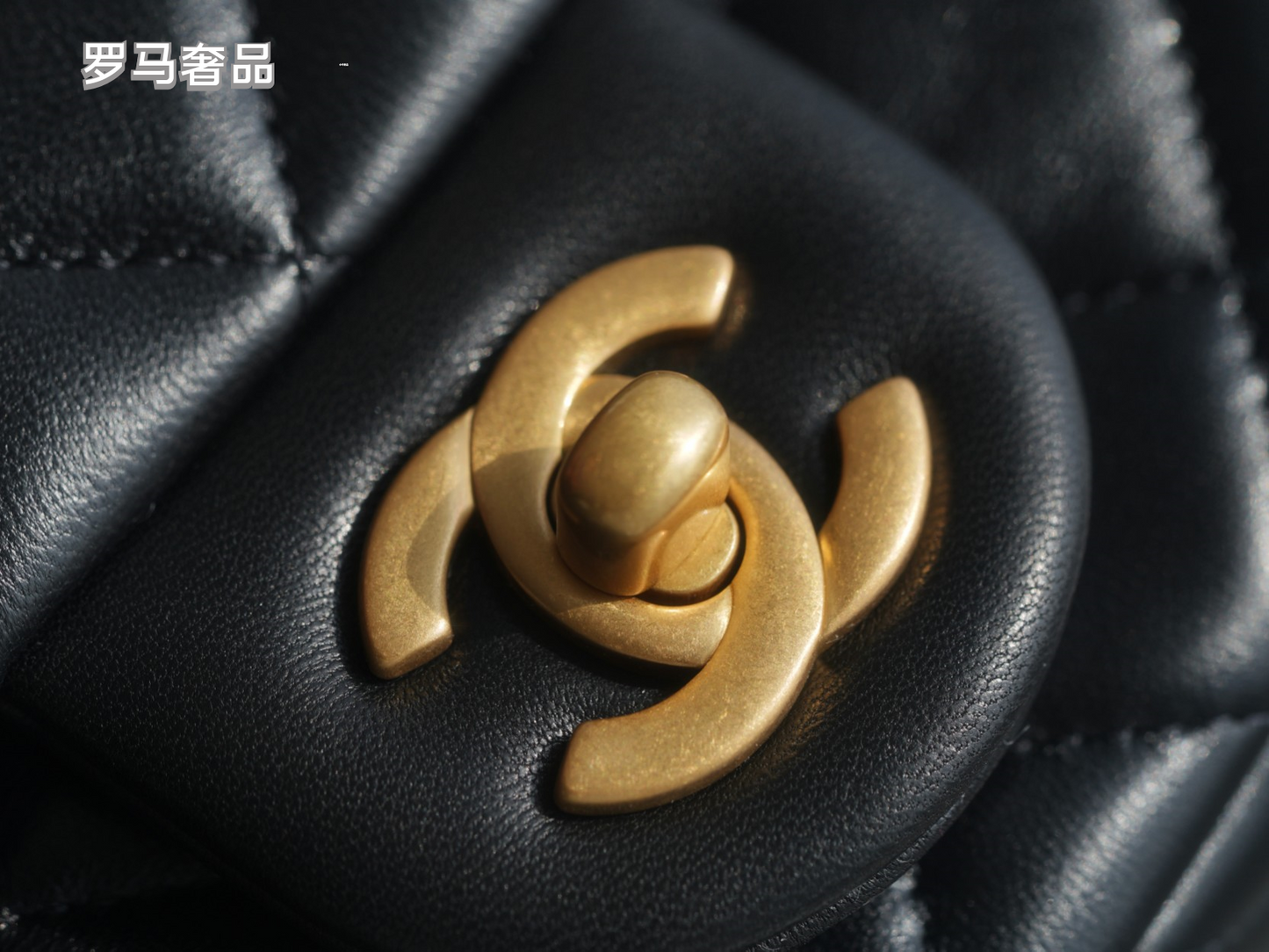 Luxury Quilted Black Leather Mini Flap Bag with Gold-Tone Chain and Ball Detail