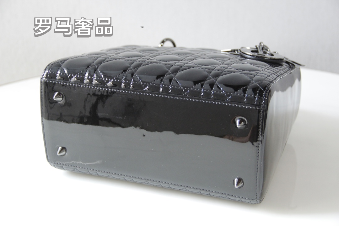 Elegant Black Quilted Top Handle Handbag with Gold-Tone Charms