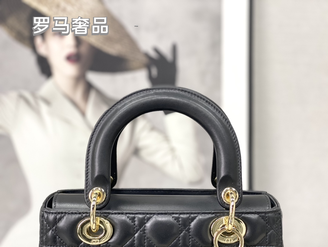 Elegant Black Quilted Top Handle Handbag with Gold-Tone Charms