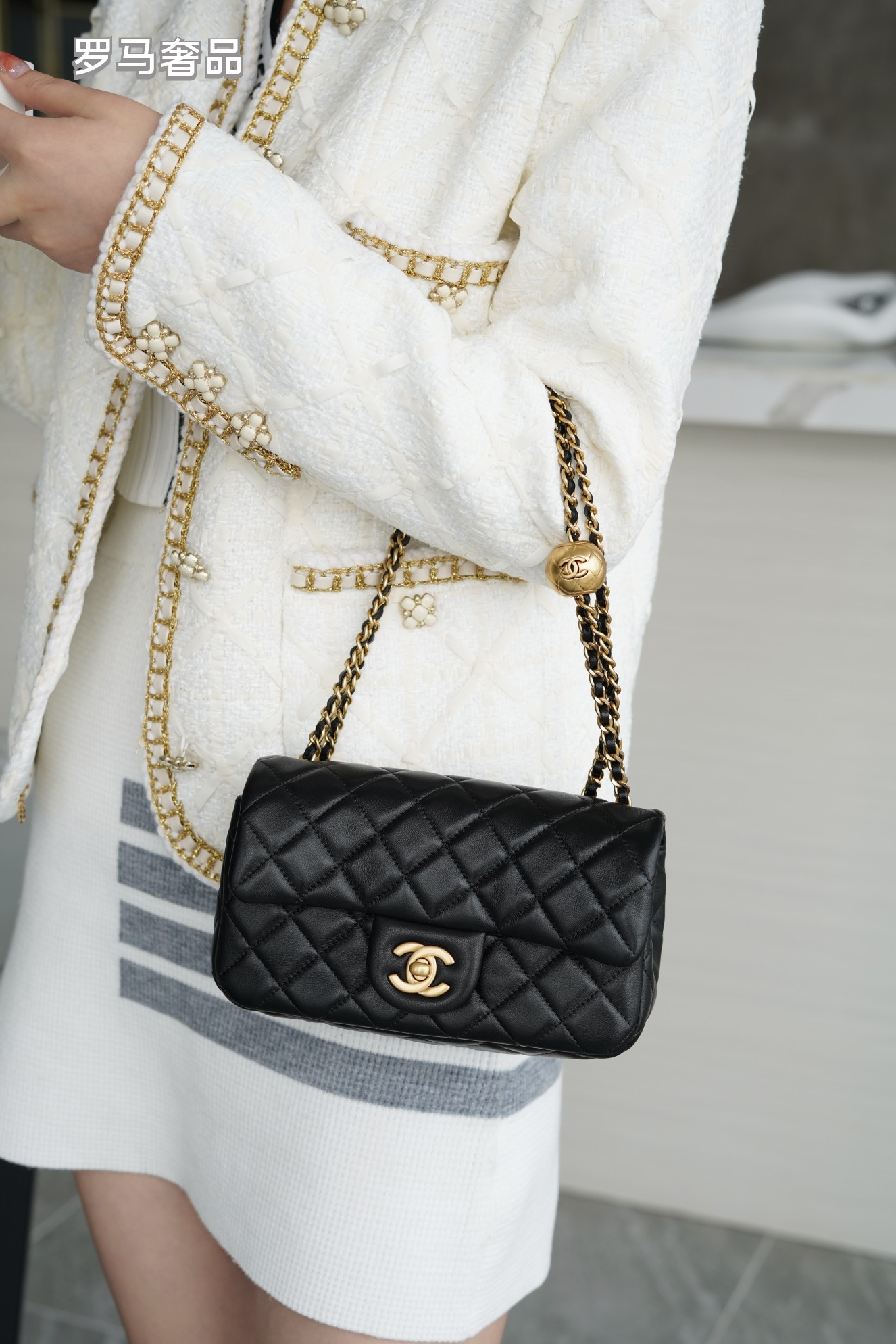 Luxury Quilted Black Leather Mini Flap Bag with Gold-Tone Chain and Ball Detail