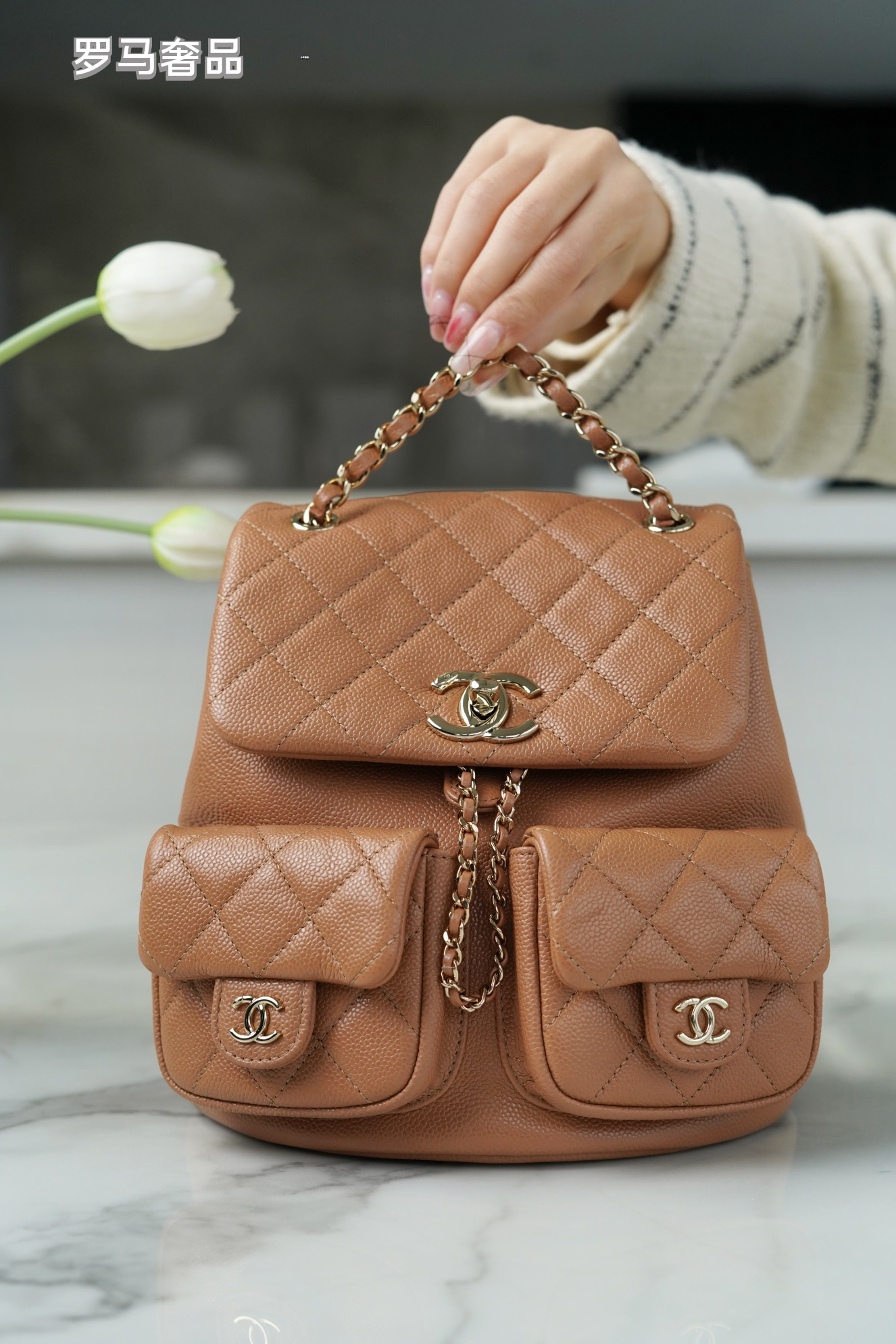 Black Quilted Leather Backpack with Gold-Tone Chain Straps