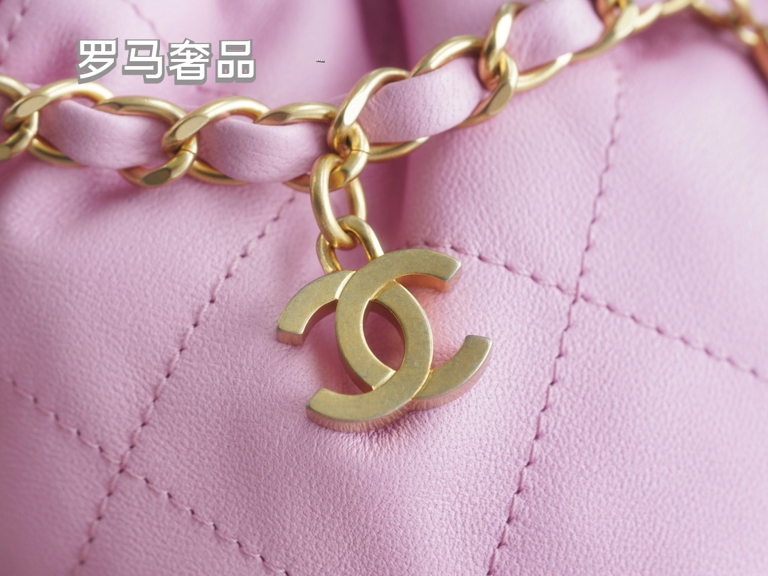 Pink Quilted Leather Bucket Bag with Gold-Tone Chain and Decorative Charms