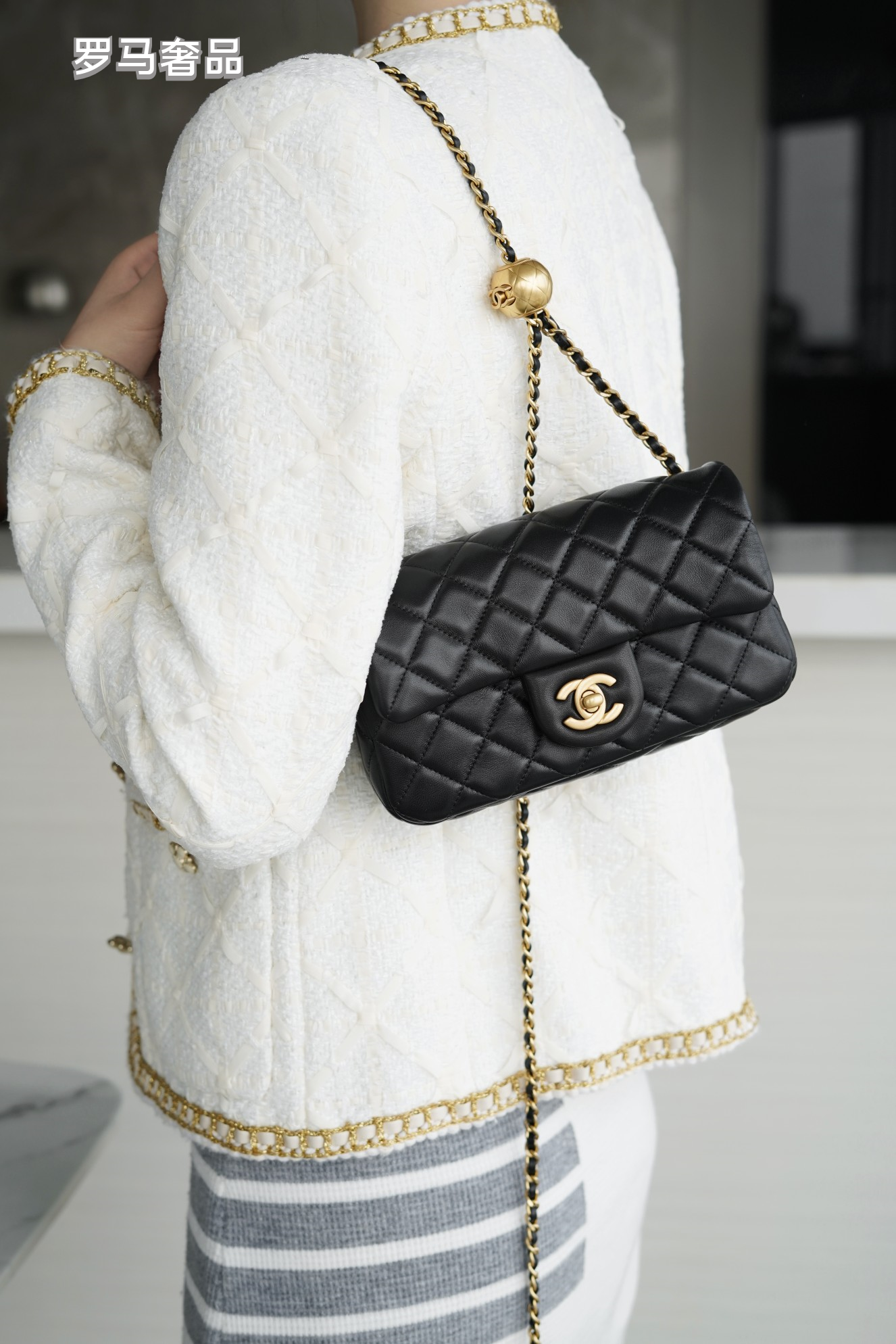 Luxury Quilted Black Leather Mini Flap Bag with Gold-Tone Chain and Ball Detail