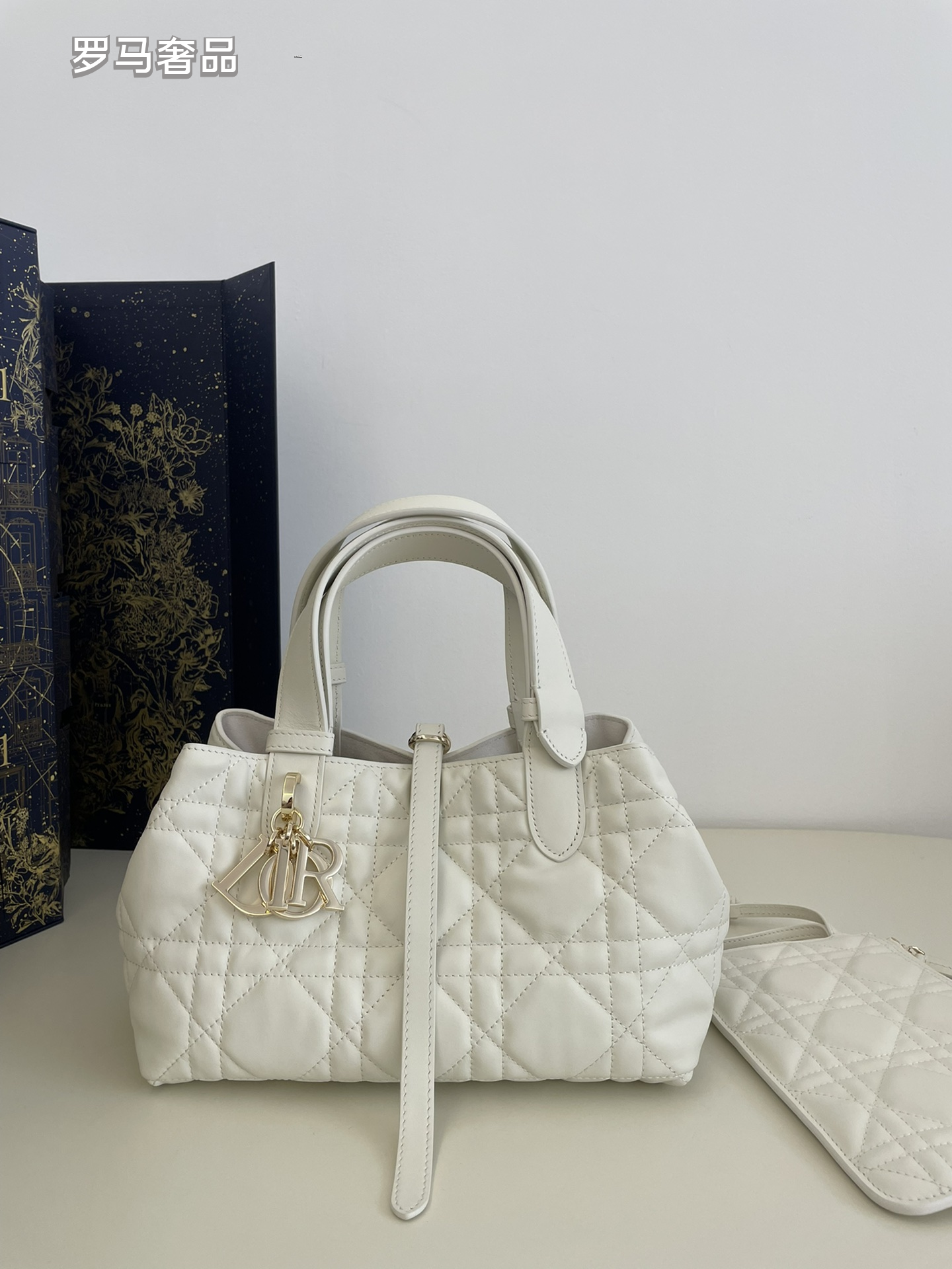 Dior Elegant Black Quilted Top Handle Handbag with Gold Letter Charms