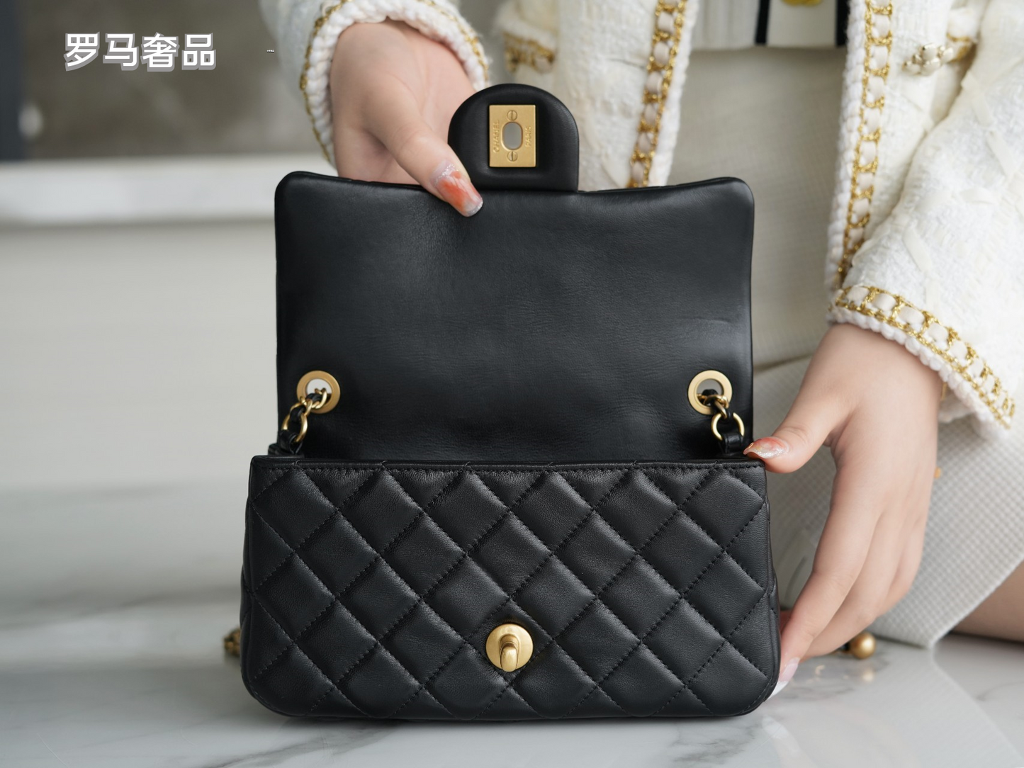 Luxury Quilted Black Leather Mini Flap Bag with Gold-Tone Chain and Ball Detail