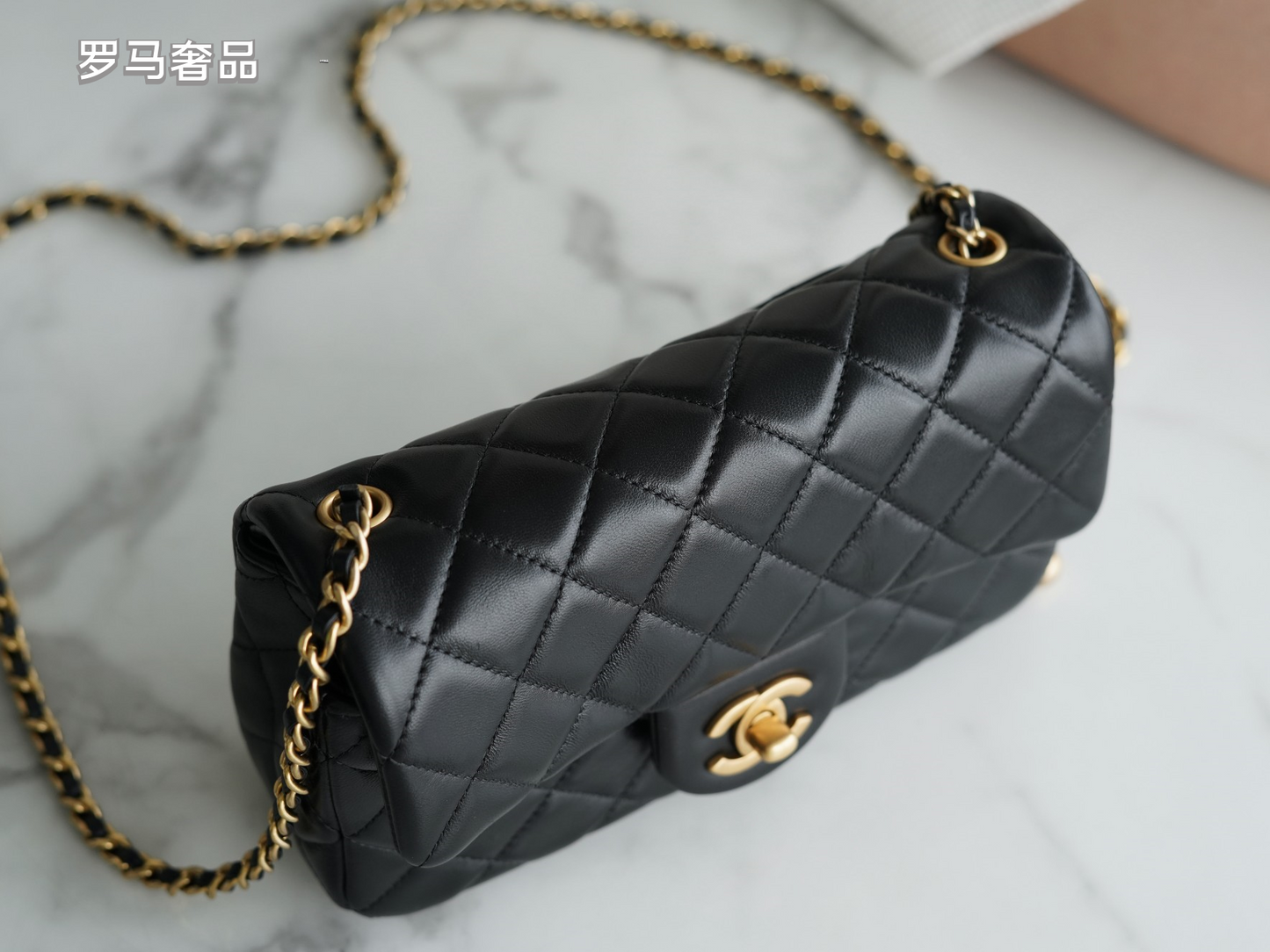 Luxury Quilted Black Leather Mini Flap Bag with Gold-Tone Chain and Ball Detail