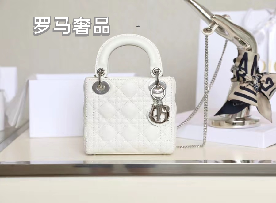 Elegant White Quilted Mini Handbag with Top Handle and Gold-Tone Charms