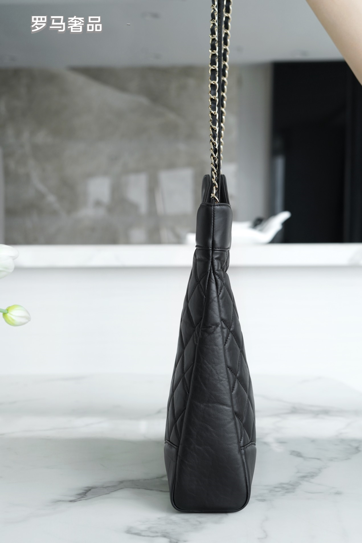 Luxury Black Quilted Leather Handbag with Gold-Tone Chain Strap and Cut-Out Handles