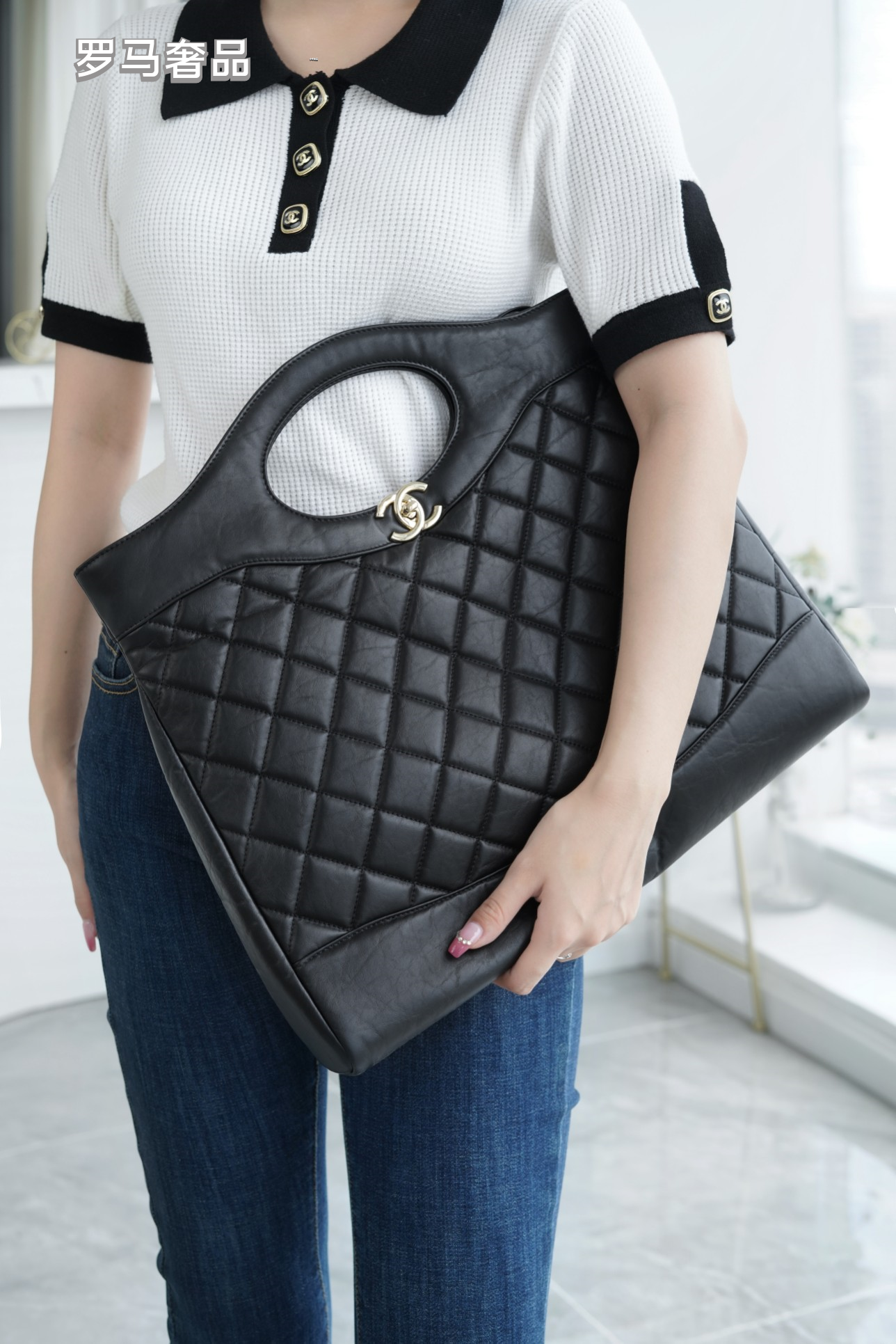Luxury Black Quilted Leather Handbag with Gold-Tone Chain Strap and Cut-Out Handles