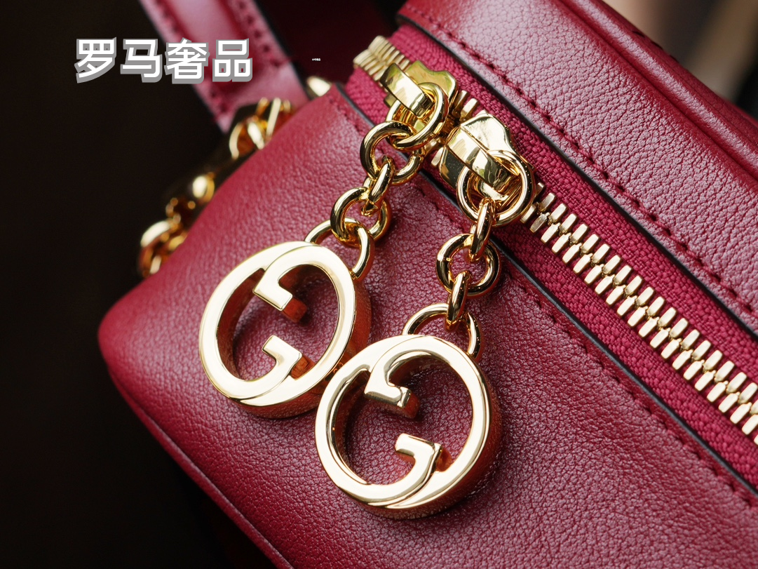 Gucci Red Leather Crossbody Camera Bag with Embossed Logo and Tassel