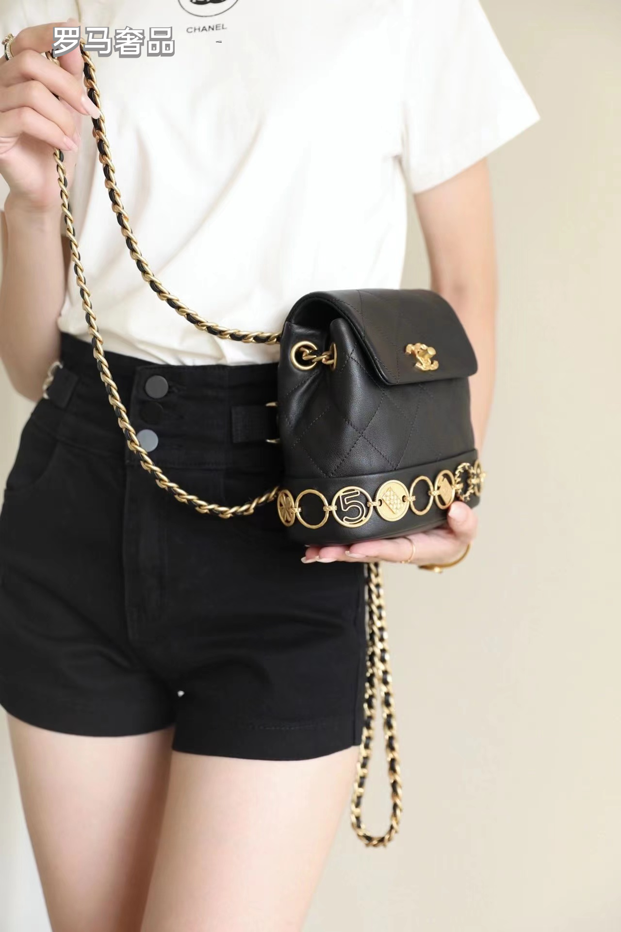 Chanel Vintage Mini Quilted Leather Backpack with Medallion Charm Chain Detail - Black/Gold