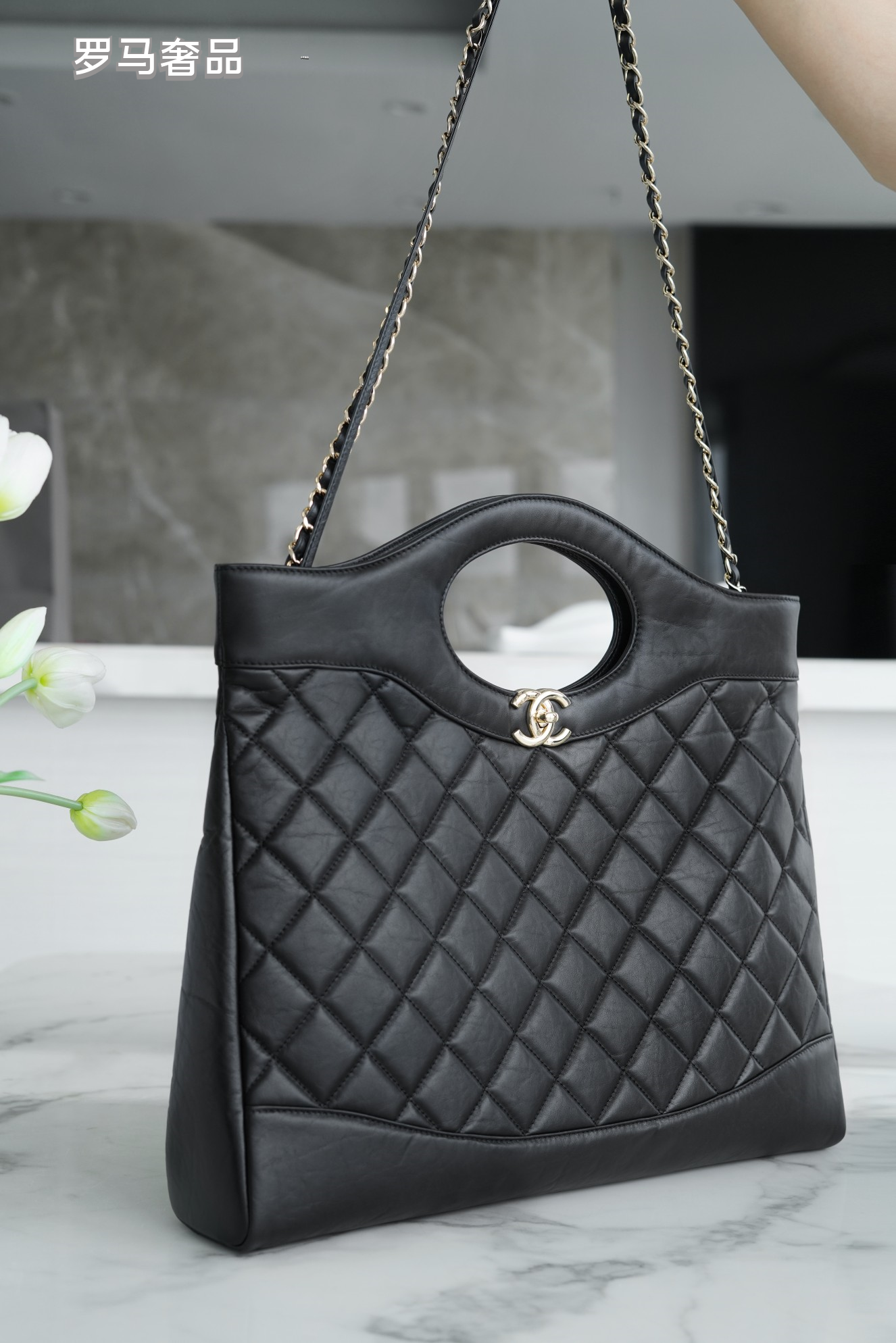 Luxury Black Quilted Leather Handbag with Gold-Tone Chain Strap and Cut-Out Handles