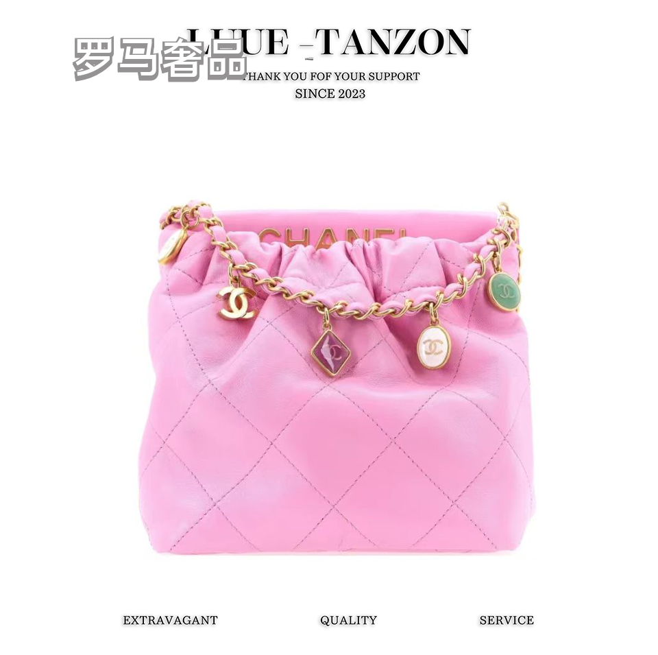 Pink Quilted Leather Bucket Bag with Gold-Tone Chain and Decorative Charms