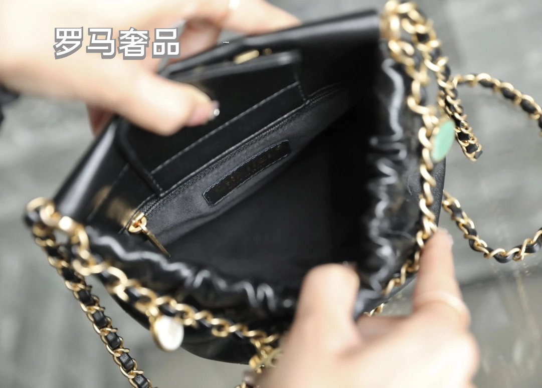 Chanel 22 Small Handbag Black Quilted Leather Gold-Tone Charms