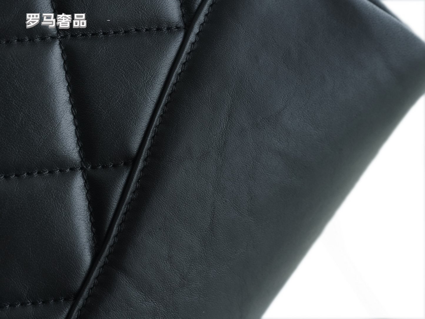 Luxury Black Quilted Leather Handbag with Gold-Tone Chain Strap and Cut-Out Handles