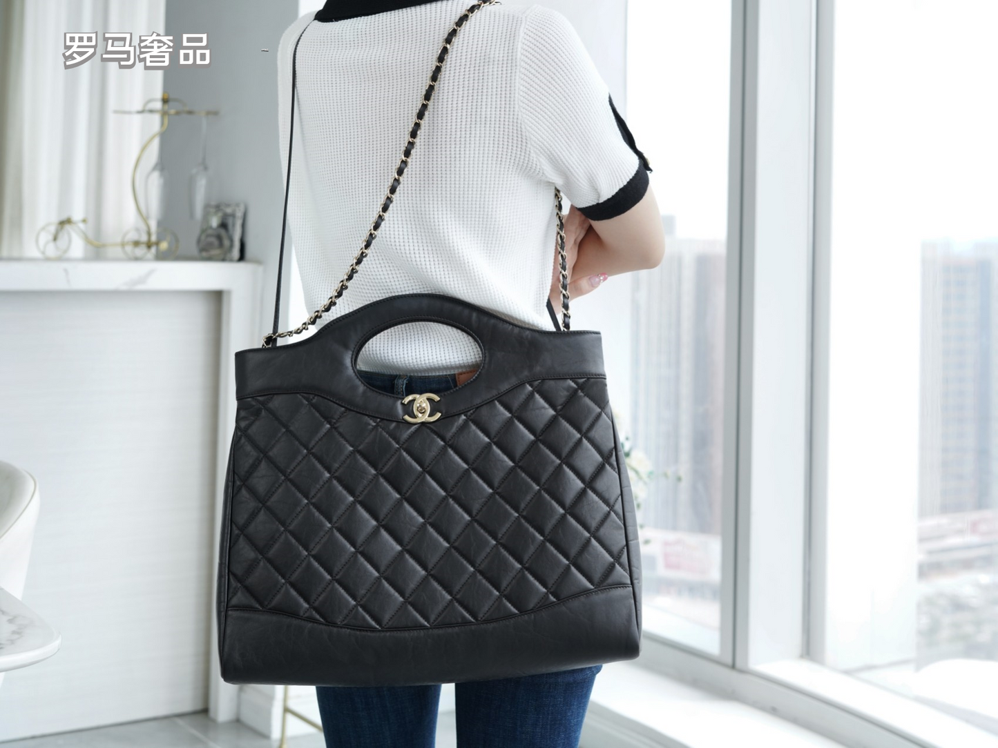 Luxury Black Quilted Leather Handbag with Gold-Tone Chain Strap and Cut-Out Handles
