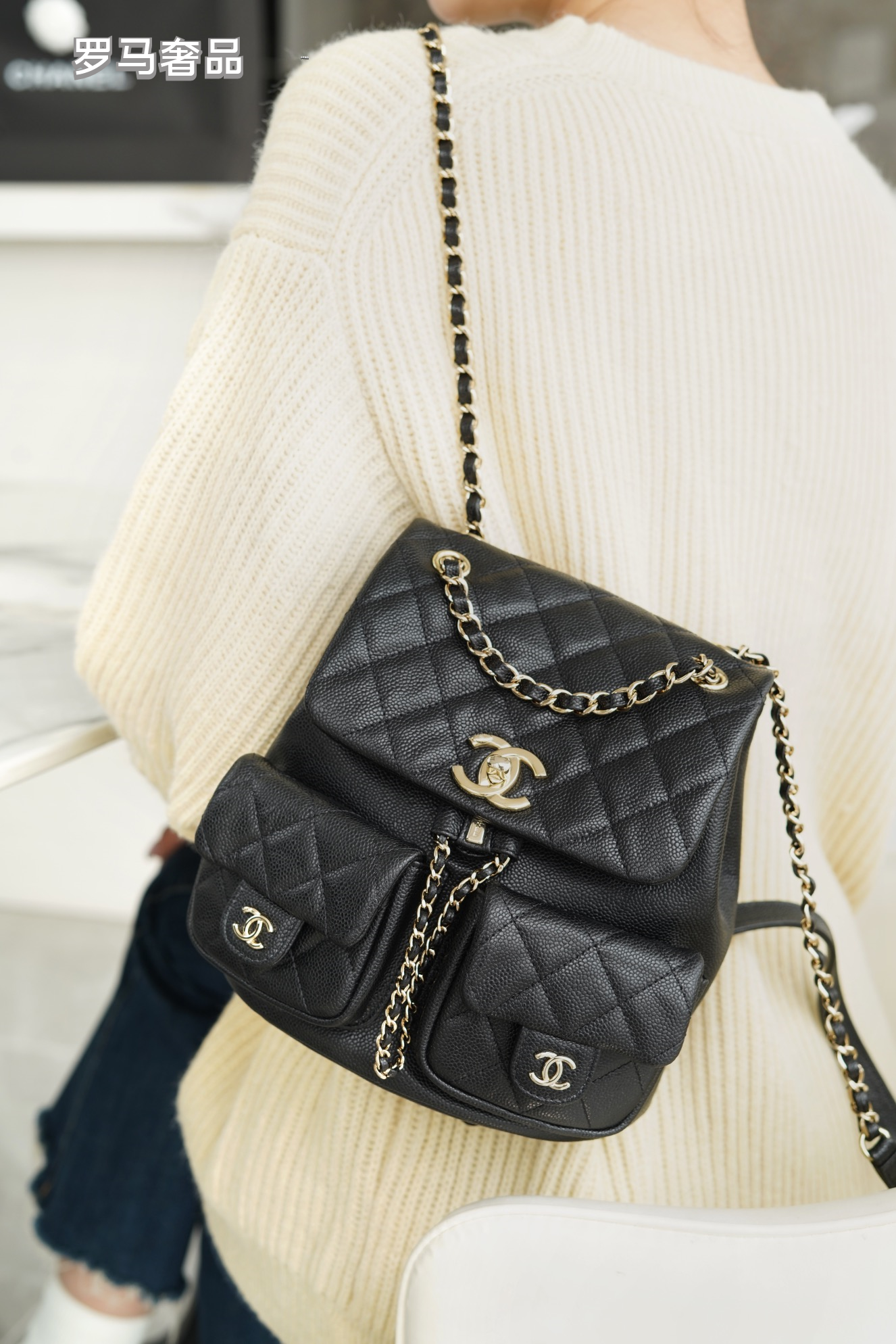 Black Quilted Leather Backpack with Gold-Tone Chain Straps