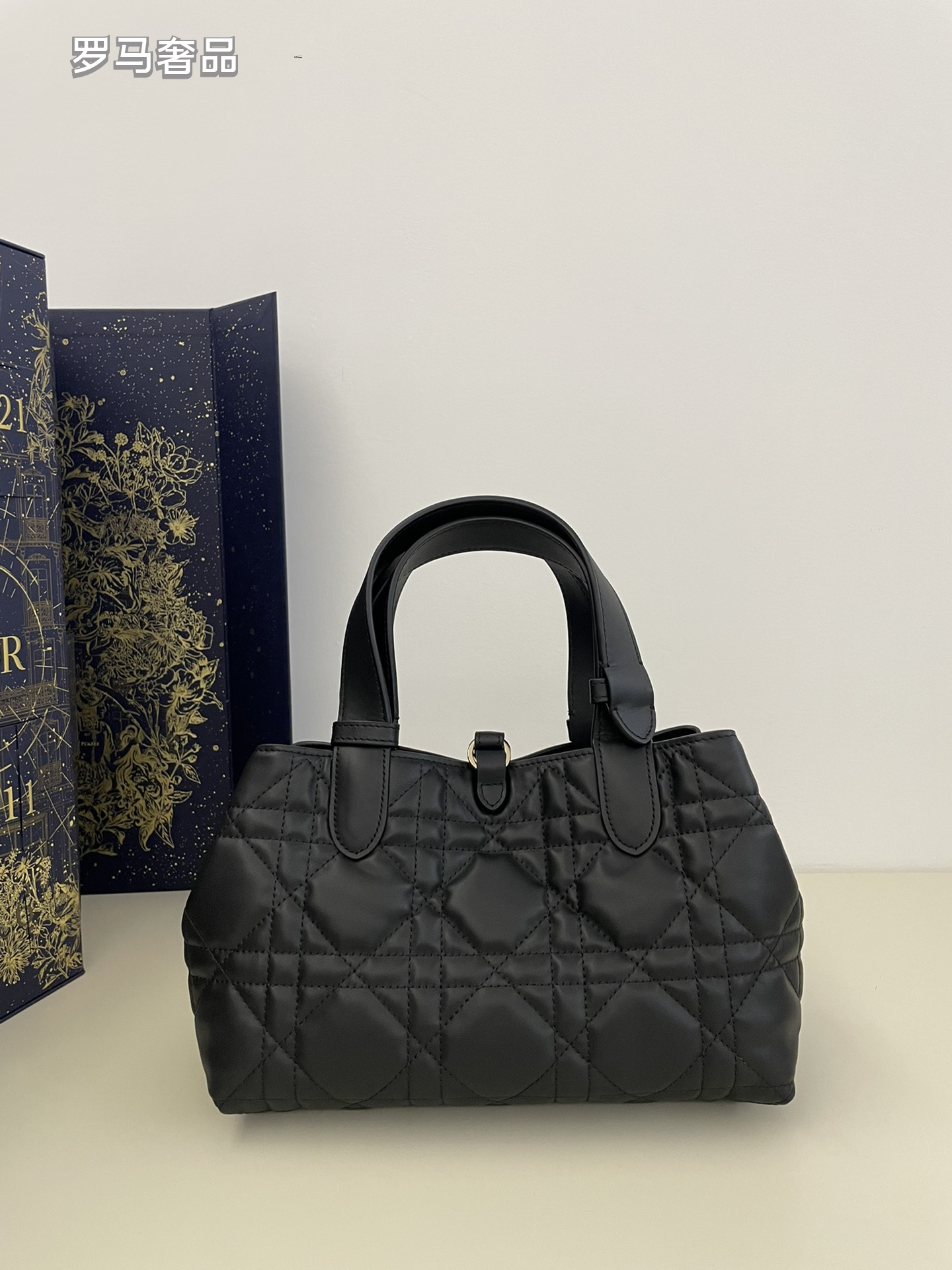 Dior Elegant Black Quilted Top Handle Handbag with Gold Letter Charms
