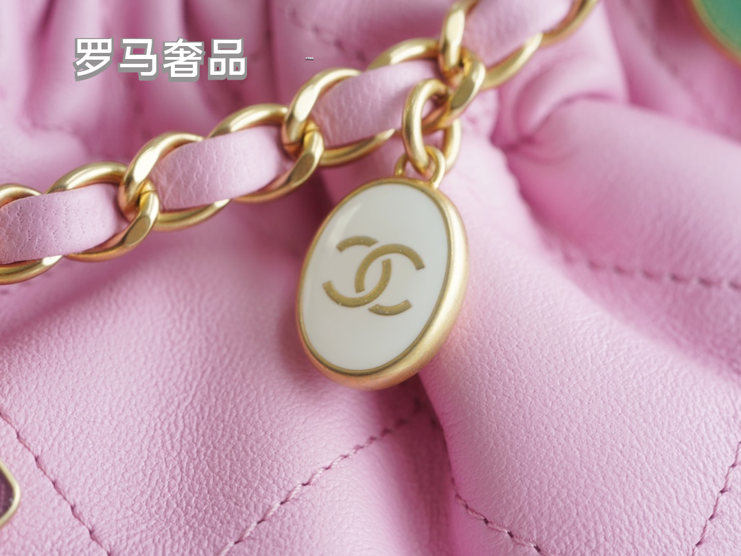 Pink Quilted Leather Bucket Bag with Gold-Tone Chain and Decorative Charms