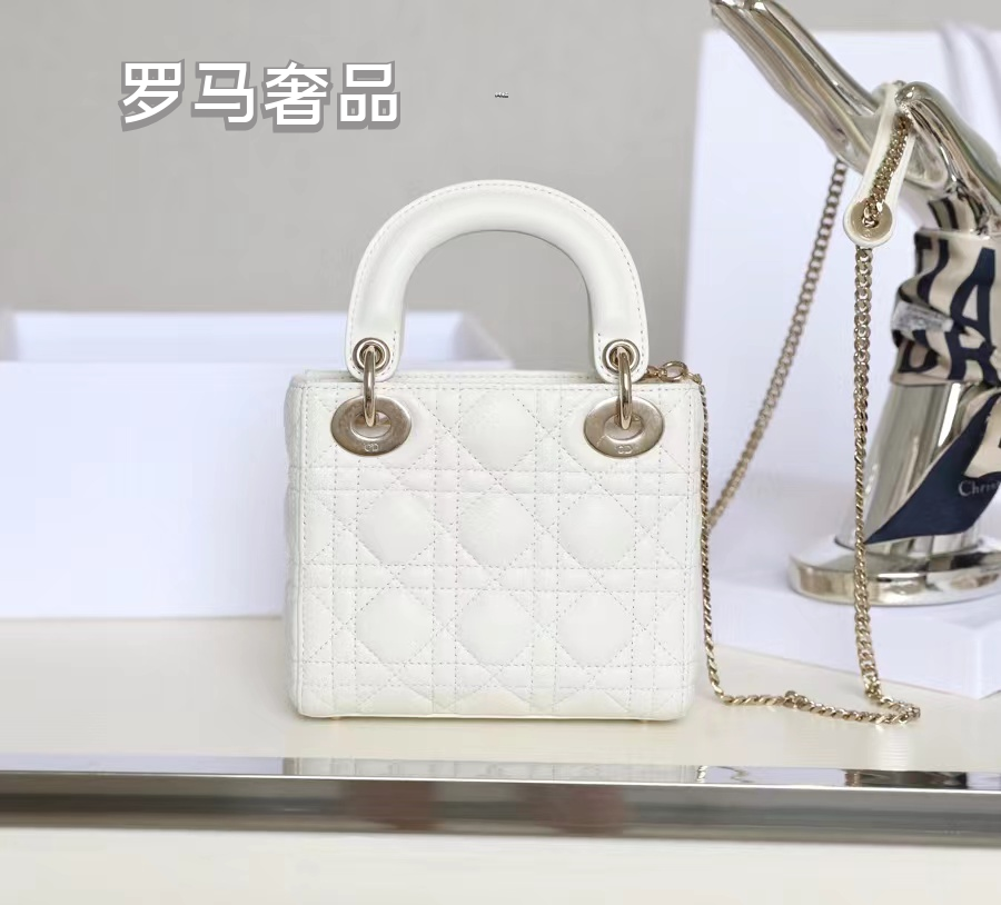 Elegant White Quilted Mini Handbag with Top Handle and Gold-Tone Charms