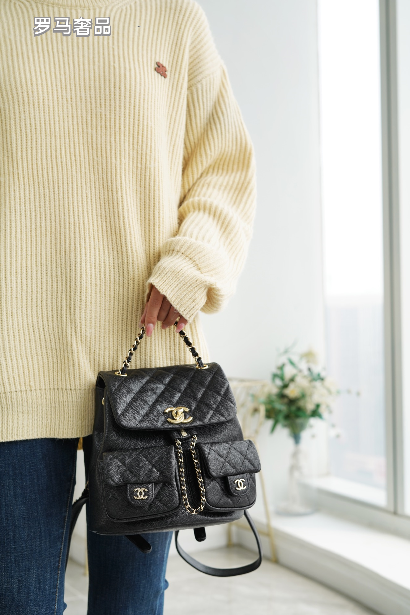 Black Quilted Leather Backpack with Gold-Tone Chain Straps