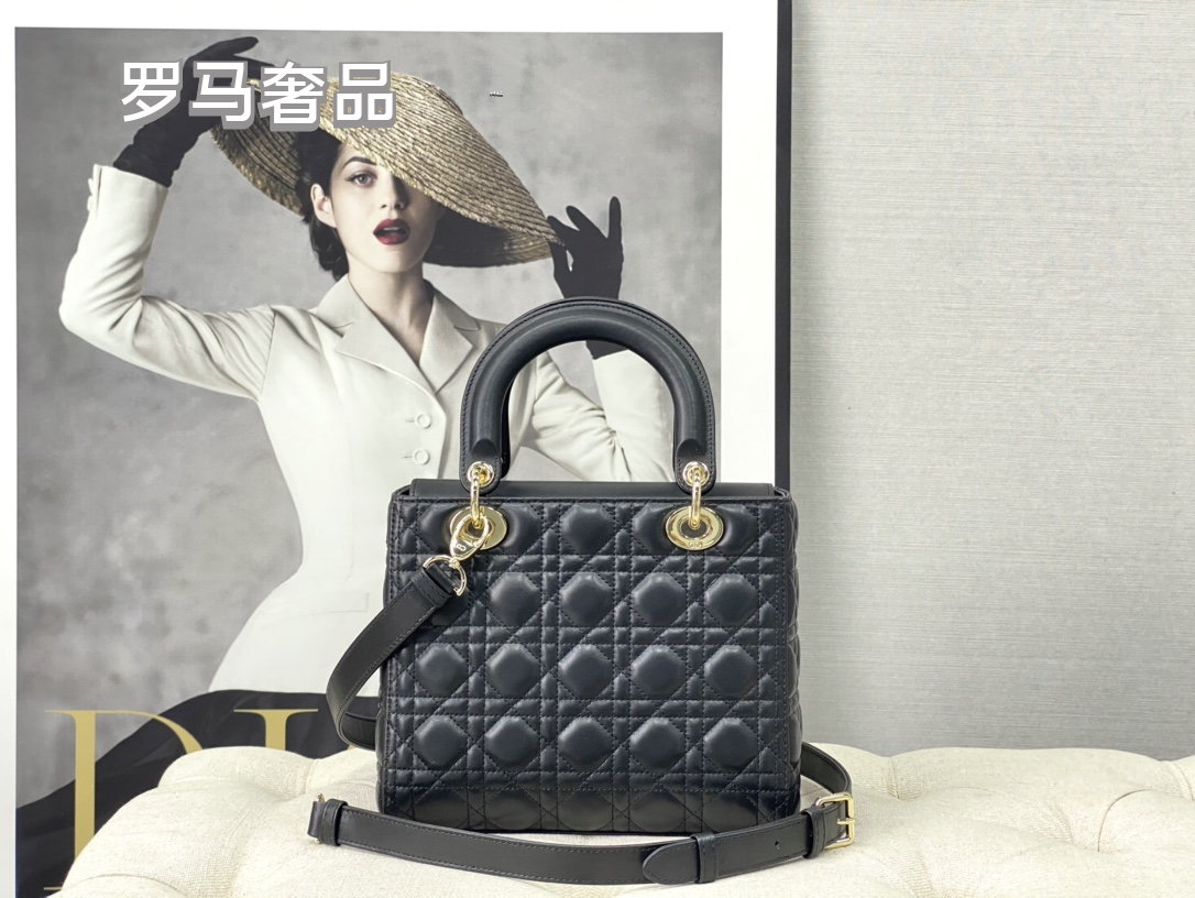 Elegant Black Quilted Top Handle Handbag with Gold-Tone Charms