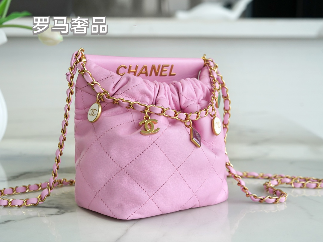 Pink Quilted Leather Bucket Bag with Gold-Tone Chain and Decorative Charms