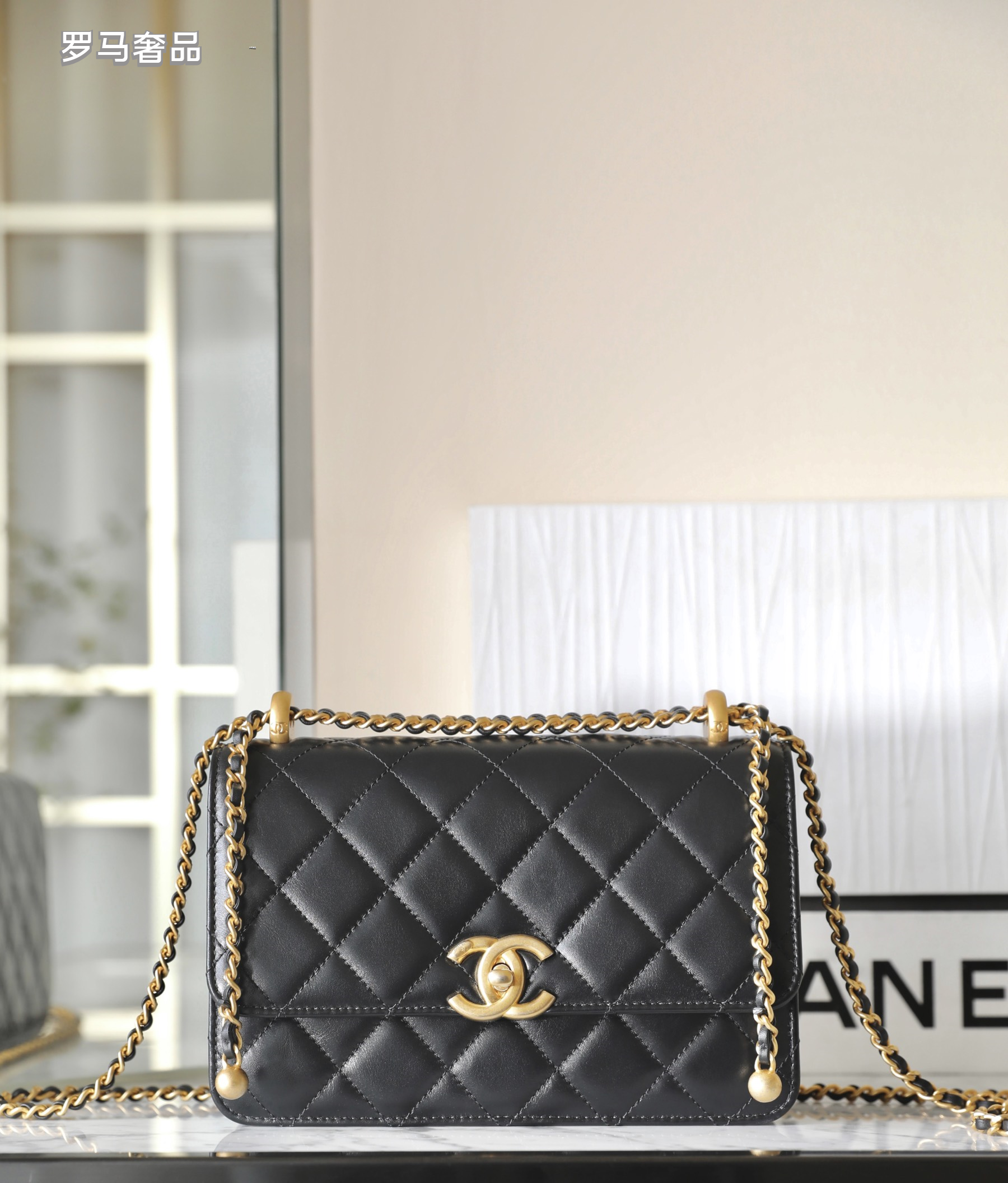 Chanel Black Quilted Lambskin Mini Flap Bag with Gold-Tone Hardware
