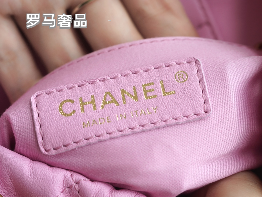 Pink Quilted Leather Bucket Bag with Gold-Tone Chain and Decorative Charms