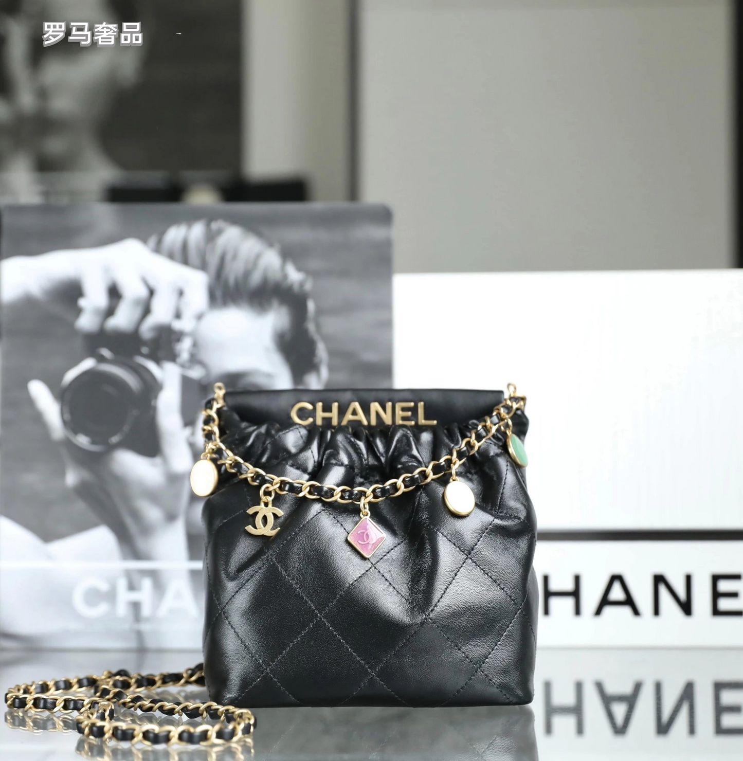 Chanel 22 Small Handbag Black Quilted Leather Gold-Tone Charms
