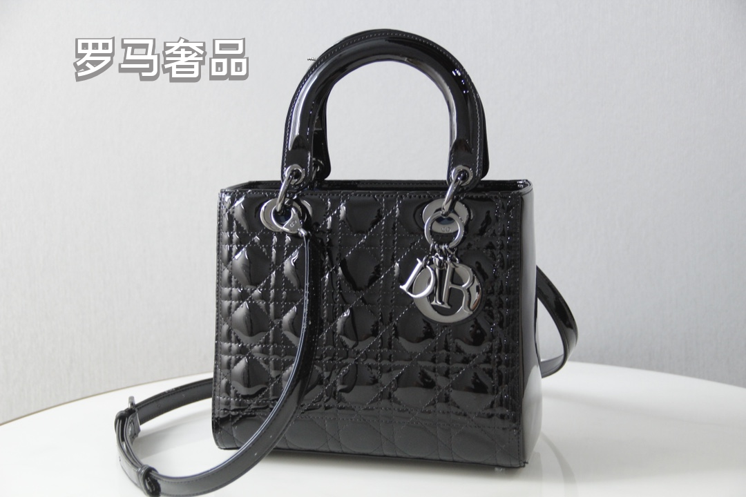 Elegant Black Quilted Top Handle Handbag with Gold-Tone Charms