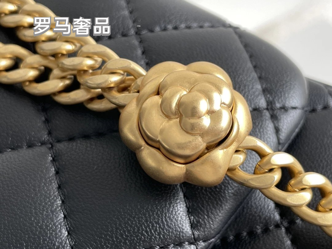 Black Quilted Leather Mini Flap Bag with Gold-Tone Chain and Camellia Charm
