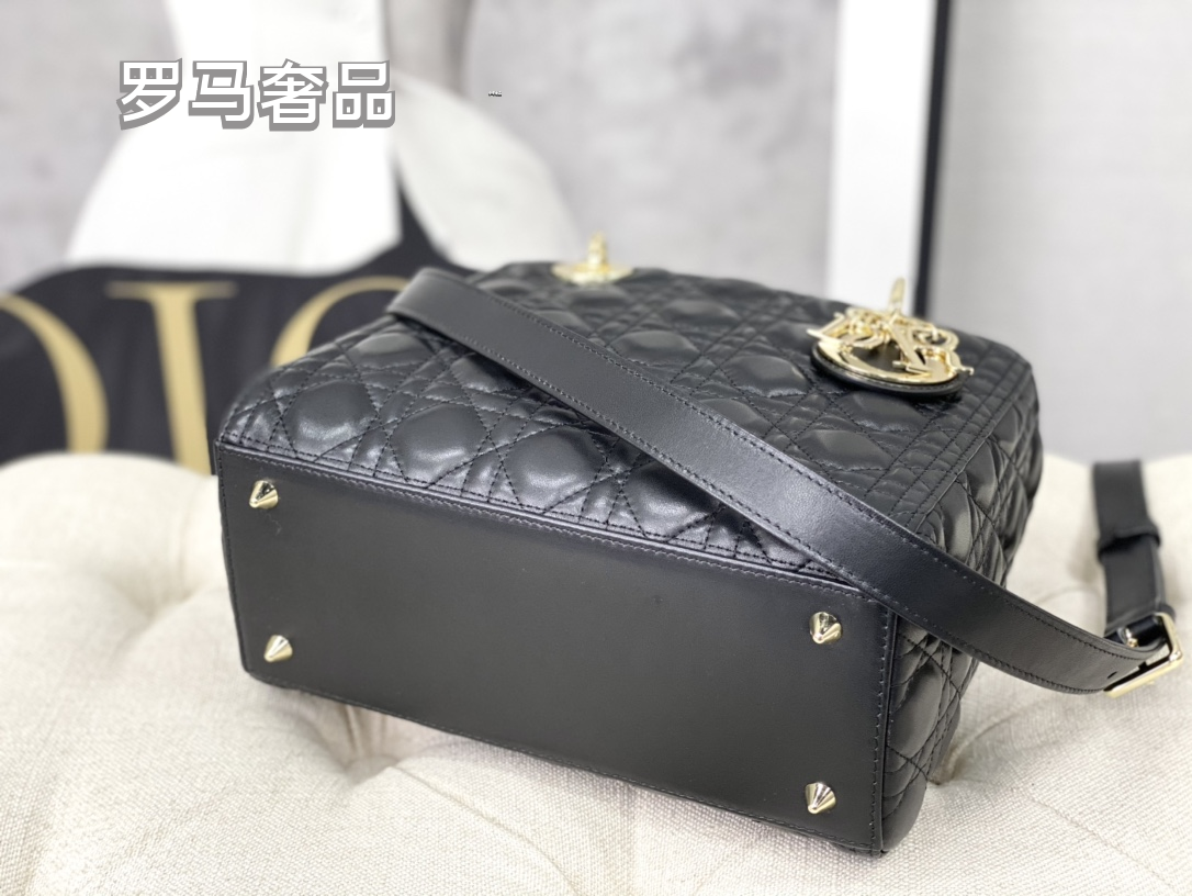 Elegant Black Quilted Top Handle Handbag with Gold-Tone Charms