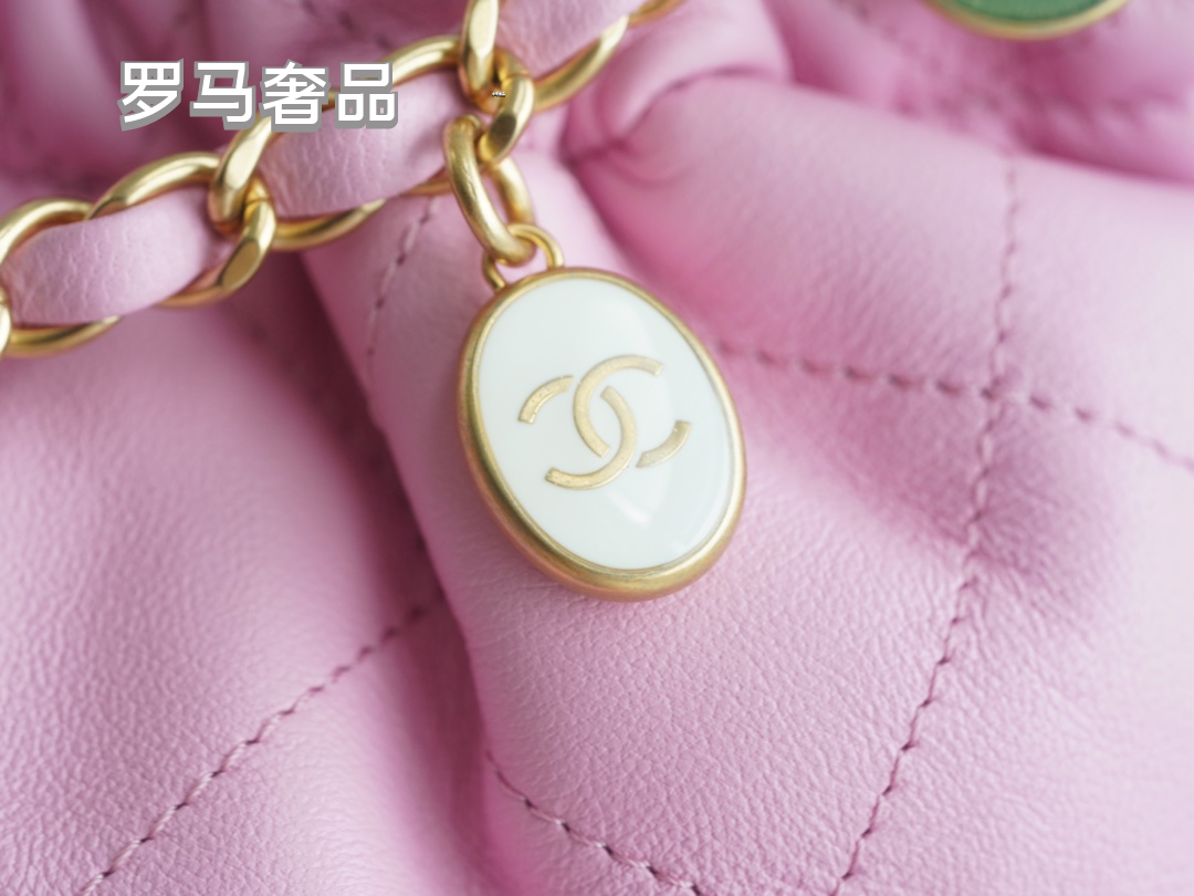 Pink Quilted Leather Bucket Bag with Gold-Tone Chain and Decorative Charms