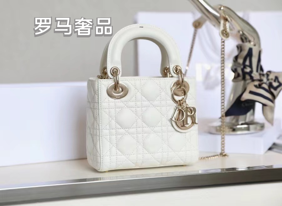 Elegant White Quilted Mini Handbag with Top Handle and Gold-Tone Charms
