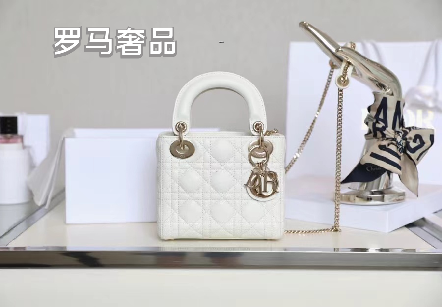 Elegant White Quilted Mini Handbag with Top Handle and Gold-Tone Charms