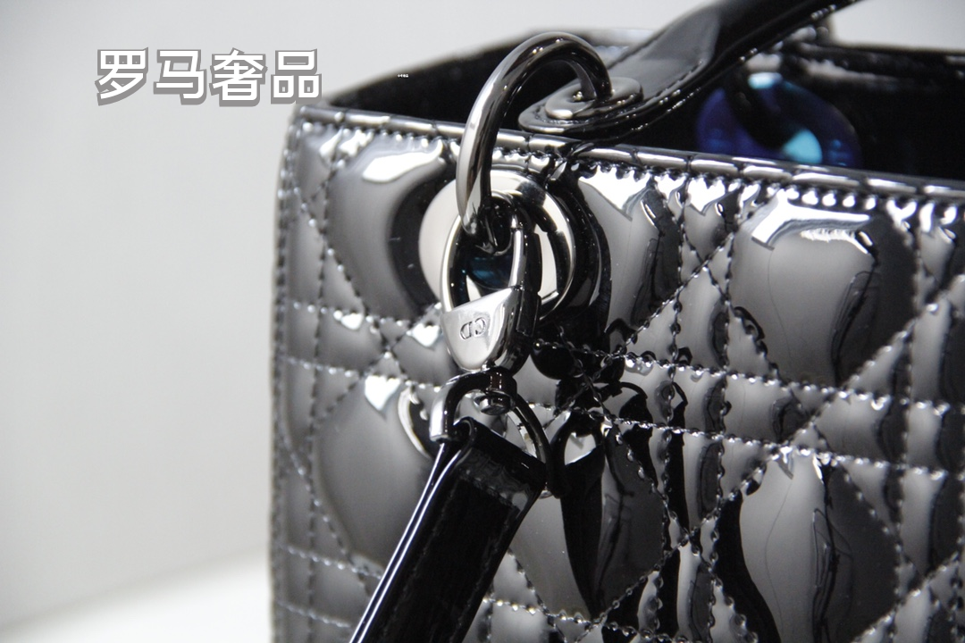 Elegant Black Quilted Top Handle Handbag with Gold-Tone Charms