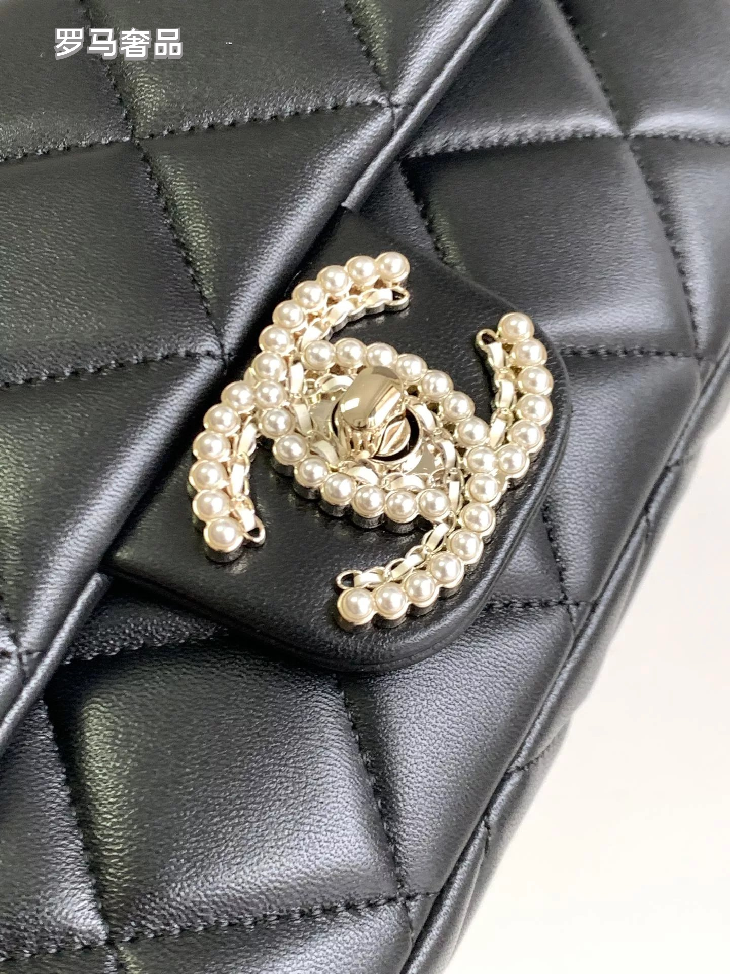 Black Quilted Leather Flap Bag with Crystal Interlocking Logo and Chain Strap