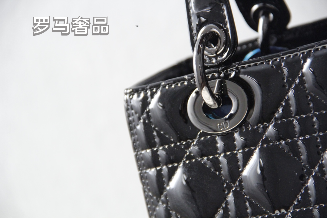 Elegant Black Quilted Top Handle Handbag with Gold-Tone Charms