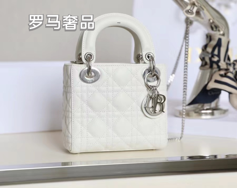 Elegant White Quilted Mini Handbag with Top Handle and Gold-Tone Charms