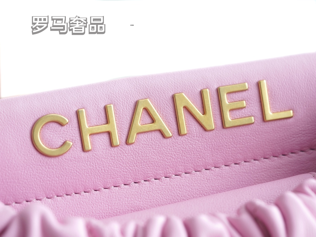 Pink Quilted Leather Bucket Bag with Gold-Tone Chain and Decorative Charms