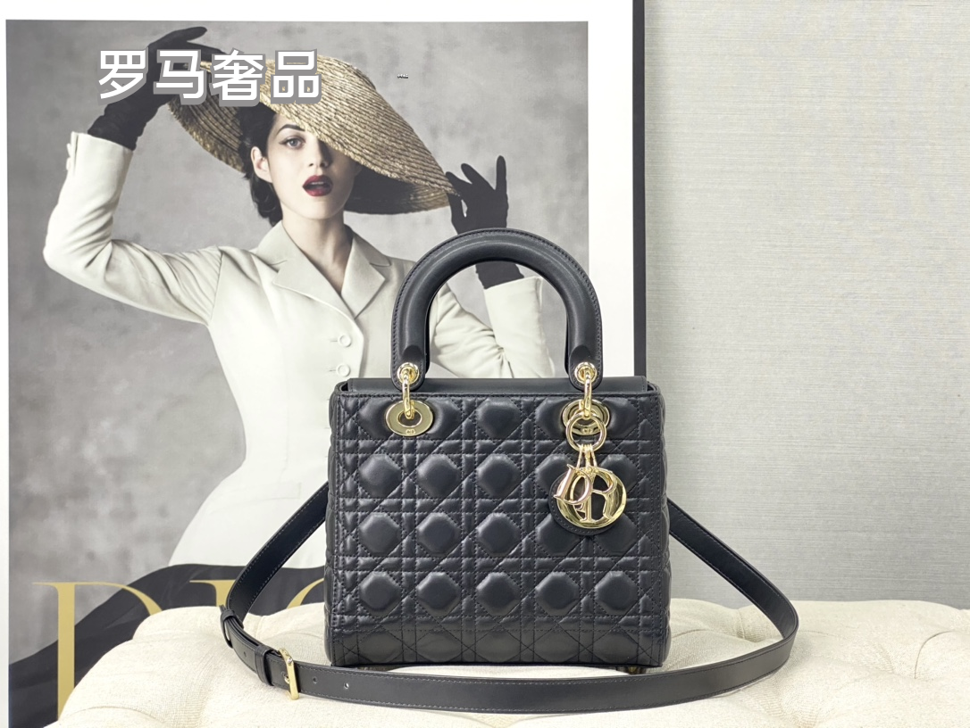 Elegant Black Quilted Top Handle Handbag with Gold-Tone Charms