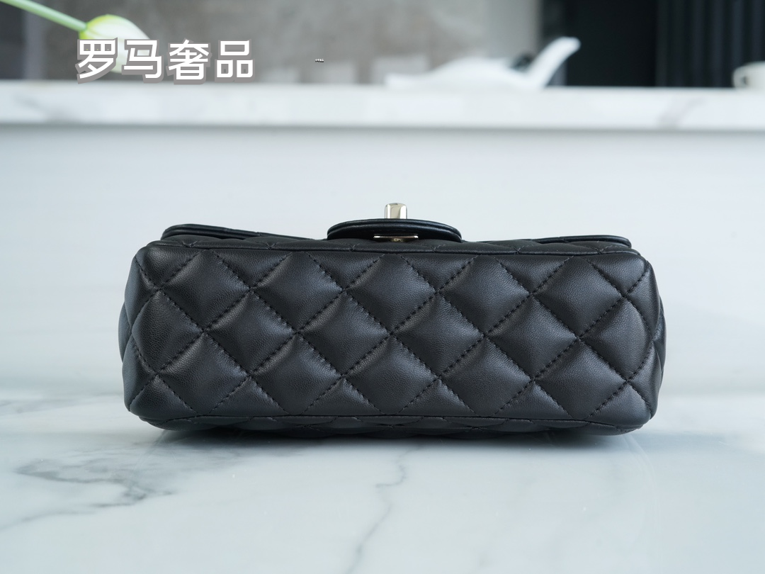 Elegant Black Quilted Leather Top Handle Flap Bag with Silver-Tone Chain
