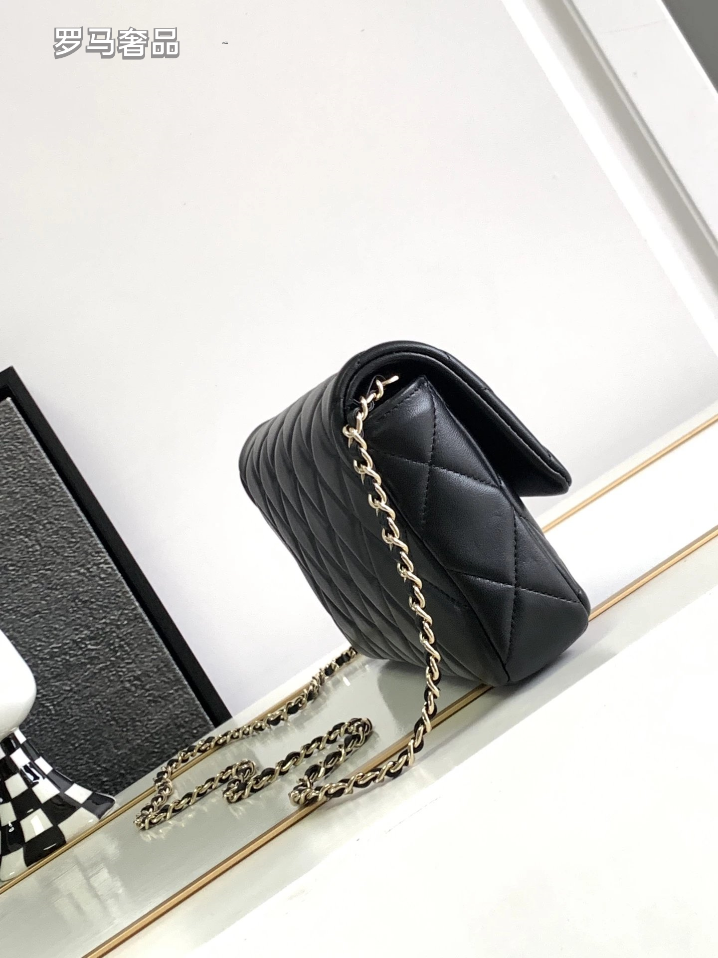 Black Quilted Leather Flap Bag with Crystal Interlocking Logo and Chain Strap