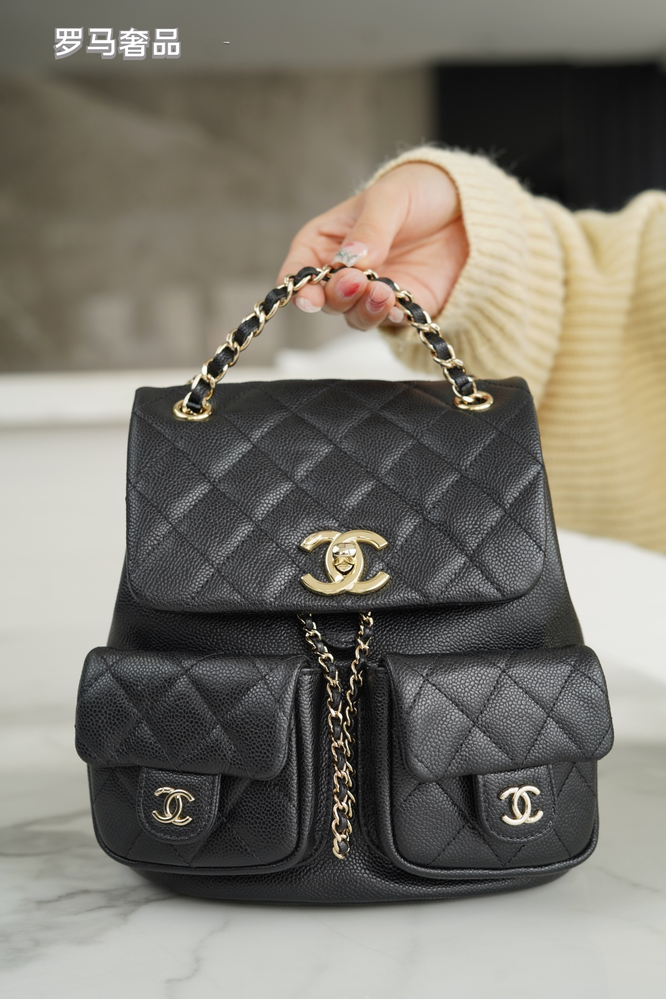 Black Quilted Leather Backpack with Gold-Tone Chain Straps