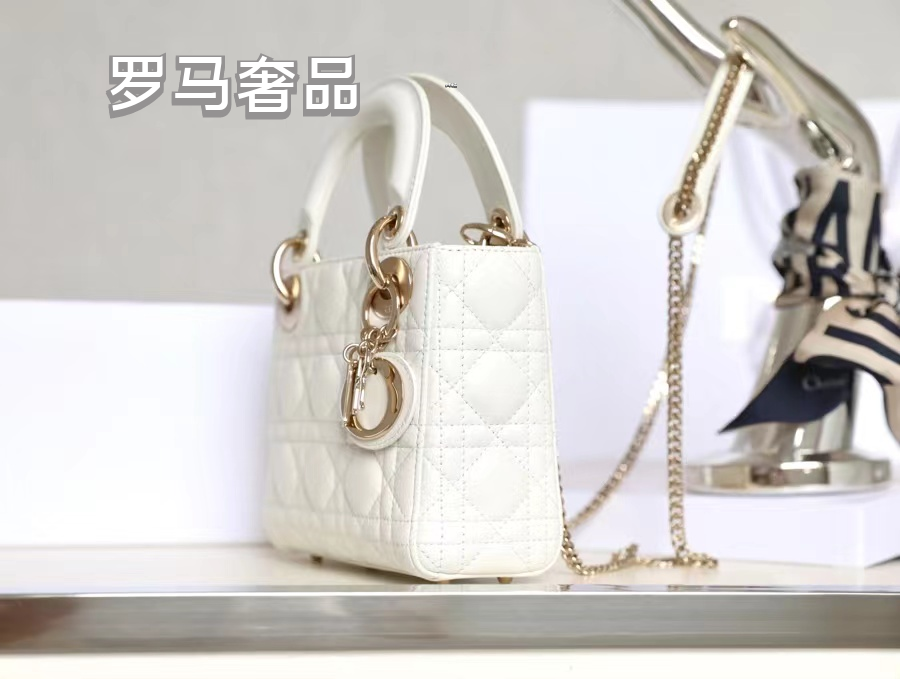 Elegant White Quilted Mini Handbag with Top Handle and Gold-Tone Charms